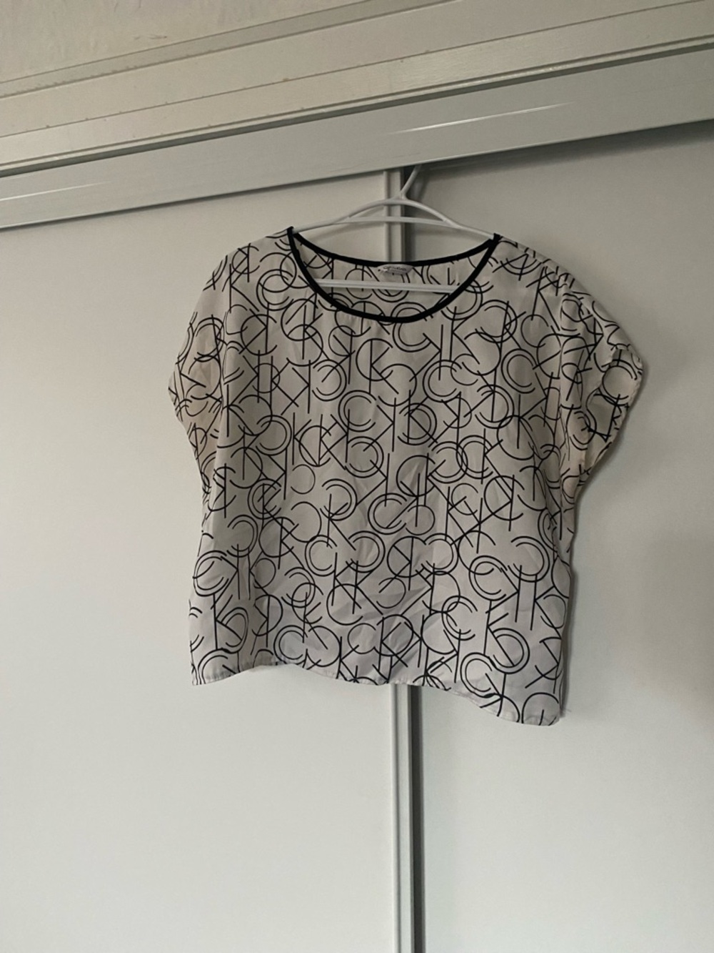Calvin Klein White Short Sleeve Top with Black Logo Pattern